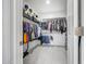 Spacious walk-in closet with built-in shelving, hanging racks, and ample storage space at 22282 N 184Th Ln, Surprise, AZ 85387