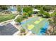 A birds eye view of a basketball court with shaded playground and community pond at 22683 N Aaron Rd, Maricopa, AZ 85138