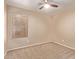 Neutral bedroom with a window and carpet flooring at 22683 N Aaron Rd, Maricopa, AZ 85138