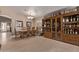 Spacious dining room featuring tile flooring, display cabinet, and neutral paint at 22683 N Aaron Rd, Maricopa, AZ 85138