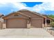 Charming single-story home with three-car garage and neutral exterior, located in a well-kept neighborhood at 22683 N Aaron Rd, Maricopa, AZ 85138