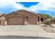 A spacious three car garage compliments this beautiful home's exterior at 22683 N Aaron Rd, Maricopa, AZ 85138