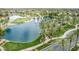 Picturesque lake view featuring fountains, palm trees, and a charming golf course adding to the community's allure at 22683 N Aaron Rd, Maricopa, AZ 85138