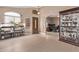 Inviting open-concept living area with tile flooring, arched doorway and natural lighting at 22683 N Aaron Rd, Maricopa, AZ 85138