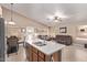Open-concept layout showcasing the kitchen, dining area, and a comfortable seating area at 22683 N Aaron Rd, Maricopa, AZ 85138