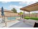 Home's backyard features a covered patio, fenced pool, and artificial grass at 2306 E Parkside Ln, Phoenix, AZ 85024