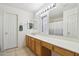Bright bathroom featuring a spacious vanity with ample counter space and generous cabinet storage at 2306 E Parkside Ln, Phoenix, AZ 85024