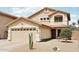 Charming two-story home with a tile roof, desert landscaping, and a two-car garage at 2306 E Parkside Ln, Phoenix, AZ 85024