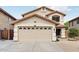 Spacious two-car garage with decorative windows and ample driveway space in front of house at 2306 E Parkside Ln, Phoenix, AZ 85024