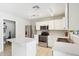 Well-equipped kitchen featuring stainless steel appliances, white cabinets, and a functional layout at 2306 E Parkside Ln, Phoenix, AZ 85024