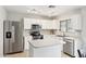 Modern kitchen with stainless steel appliances, white cabinetry, and ample counter space at 2306 E Parkside Ln, Phoenix, AZ 85024