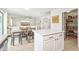 Open kitchen view with stainless steel appliances, a pantry, and a view of the living room at 2306 E Parkside Ln, Phoenix, AZ 85024