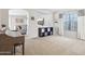 Open-concept living room with neutral walls, carpet, stylish decor, and a view of the Gathering room at 2306 E Parkside Ln, Phoenix, AZ 85024
