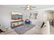 Comfortable living room with large sectional, mounted TV, and stylish decor at 2306 E Parkside Ln, Phoenix, AZ 85024