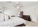 Comfortable main bedroom with a ceiling fan, natural light, and ample space for a desk and dresser at 2306 E Parkside Ln, Phoenix, AZ 85024