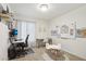 Bright office space featuring ample room for working and studying, with a small activity table for  at 2306 E Parkside Ln, Phoenix, AZ 85024