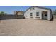 View of the house from the backyard showcasing gravel, block wall, and AC unit at 2625 W Gaby Rd, Phoenix, AZ 85041