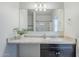 Bright bathroom features a large mirror, long countertop and modern fixtures at 2625 W Gaby Rd, Phoenix, AZ 85041