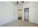 Bedroom features a closet and neutral carpet for comfort and style at 2625 W Gaby Rd, Phoenix, AZ 85041
