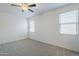 Spacious bedroom featuring a ceiling fan and two windows for natural light at 2625 W Gaby Rd, Phoenix, AZ 85041