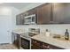 The kitchen is equipped with modern stainless steel appliances at 2625 W Gaby Rd, Phoenix, AZ 85041
