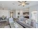 Open-concept living room with modern decor seamlessly flowing into the kitchen and dining area at 2625 W Gaby Rd, Phoenix, AZ 85041