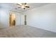 Bright main bedroom with plush carpet, ceiling fan and en-suite bath at 2625 W Gaby Rd, Phoenix, AZ 85041