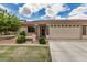 Charming single-story home with a well-manicured lawn, stone accents, and a two-car garage in a sunny setting at 2662 S Springwood Blvd # 462, Mesa, AZ 85209