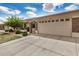 Inviting single-story home with a two-car garage, stone detailing, and desert landscaping for easy maintenance at 2662 S Springwood Blvd # 462, Mesa, AZ 85209