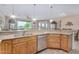 Well-lit kitchen featuring a granite countertop, stainless steel appliances, and modern cabinets at 2662 S Springwood Blvd # 462, Mesa, AZ 85209