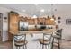 Open kitchen featuring a breakfast bar with seating, stainless steel appliances, and wood cabinetry at 2662 S Springwood Blvd # 462, Mesa, AZ 85209
