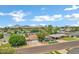 A high-angle view shows the neighborhood with houses, trees and mountain landscape at 3046 E Glenrosa Ave, Phoenix, AZ 85016