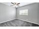 Bedroom featuring neutral walls, ceiling fan with light fixture, carpet flooring, and a window providing natural light at 3046 E Glenrosa Ave, Phoenix, AZ 85016
