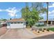 Charming home featuring a two-car garage and well-maintained front yard at 3046 E Glenrosa Ave, Phoenix, AZ 85016
