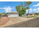 Charming home featuring a two-car garage, mature trees, and well-maintained landscaping at 3046 E Glenrosa Ave, Phoenix, AZ 85016