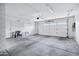 Spacious garage with ample room for parking and storage, featuring a roll-up door at 3046 E Glenrosa Ave, Phoenix, AZ 85016