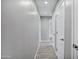 Hallway with neutral walls and floors plus doors leading to bathroom and other rooms at 3046 E Glenrosa Ave, Phoenix, AZ 85016