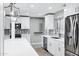 Newly renovated kitchen with white cabinets, stainless steel appliances and a large island at 3046 E Glenrosa Ave, Phoenix, AZ 85016