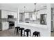 Modern kitchen featuring white cabinetry, stainless steel appliances, and a quartz island at 3046 E Glenrosa Ave, Phoenix, AZ 85016
