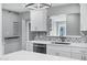 Bright kitchen with stainless steel appliances, white cabinetry, and a unique backsplash design at 3046 E Glenrosa Ave, Phoenix, AZ 85016