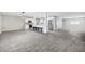 Open-concept living room with new flooring, kitchen island and stainless steel appliances at 3046 E Glenrosa Ave, Phoenix, AZ 85016