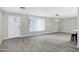 Open-concept living room, with new flooring, big window and access to kitchen at 3046 E Glenrosa Ave, Phoenix, AZ 85016