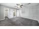Main bedroom features neutral walls, plush carpeting, ceiling fan and ensuite bathroom access at 3046 E Glenrosa Ave, Phoenix, AZ 85016