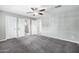 Spacious main bedroom with carpeting, ceiling fan, and three closets, one leading to the bath at 3046 E Glenrosa Ave, Phoenix, AZ 85016