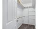 Bright walk-in closet with carpet flooring, shelves, and hanging rods at 3046 E Glenrosa Ave, Phoenix, AZ 85016