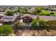 This backyard oasis features a pool and outdoor seating, as seen from an aerial perspective at 3488 N Lady Lake Ln, Casa Grande, AZ 85122