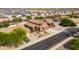 An aerial view shows this beautiful home, its well-manicured landscaping, and the surrounding neighborhood at 3488 N Lady Lake Ln, Casa Grande, AZ 85122