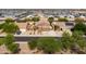 Discover a great home with lush landscaping and solar panels in this aerial view at 3488 N Lady Lake Ln, Casa Grande, AZ 85122