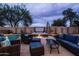 Relaxing backyard with a refreshing pool, hot tub, and cozy seating area at 3488 N Lady Lake Ln, Casa Grande, AZ 85122
