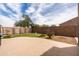 Low-maintenance backyard featuring putting green and patio space at 3488 N Lady Lake Ln, Casa Grande, AZ 85122